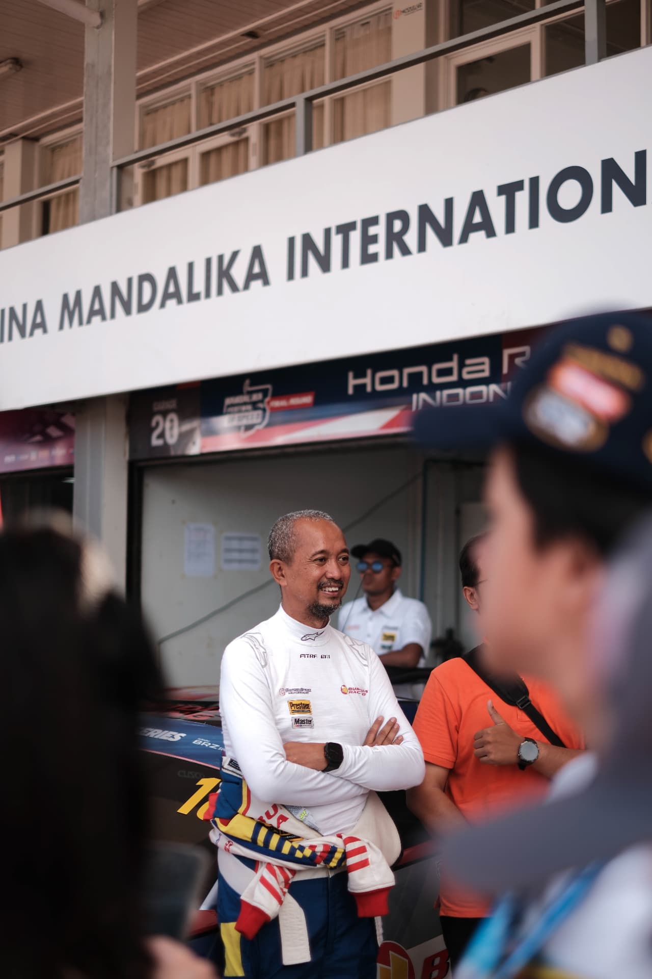 Driver smiling in the pit lane before the race